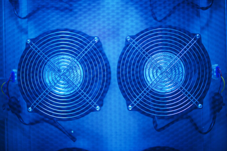 two fans are shown in a blue light