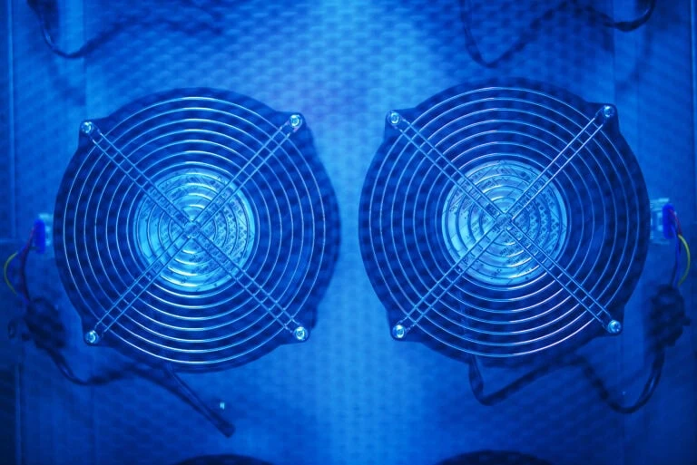 two fans are shown in a blue light